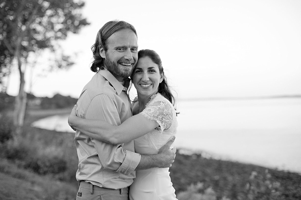 black and white photo of couple embracing at wedding at the Inn at Ocean's Edge