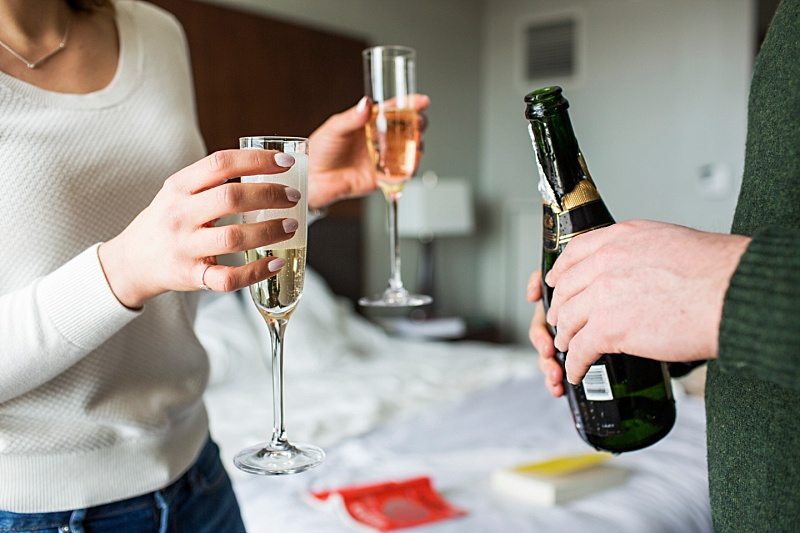 couple with champagne and champagne flutes