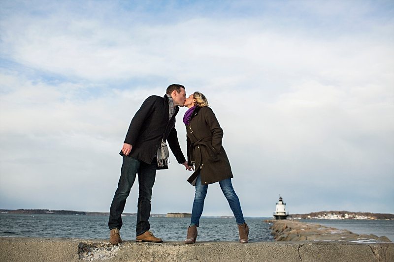 Couple kissing in front of Spring Point Ledge Light