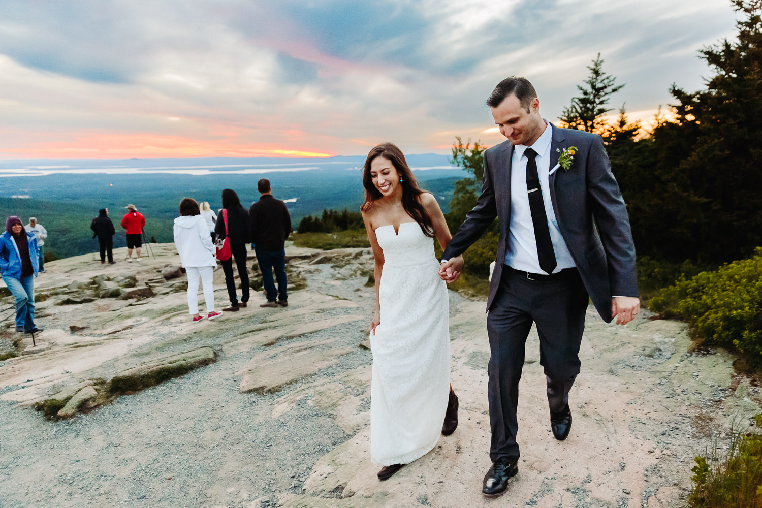 Bride and groom leaving Cadillac Mountain together on their wedding day.