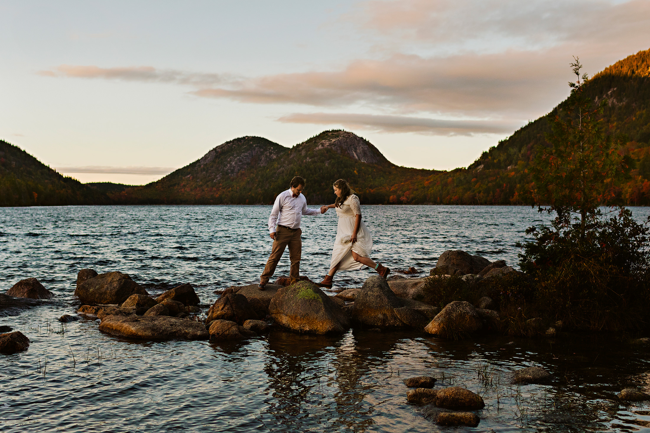 bride and groom exploring Jordan Pond during their elopement in Acadia National Park