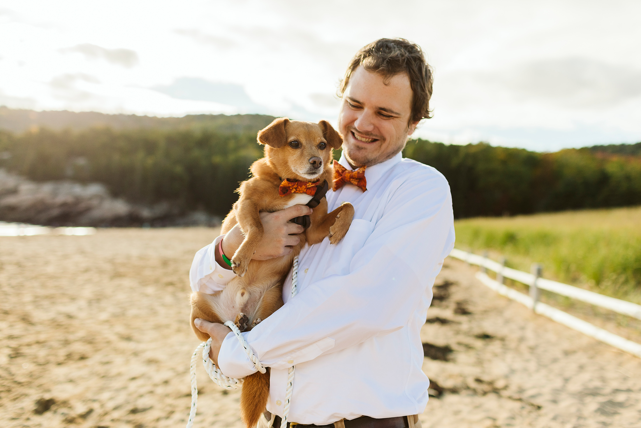 groom and his dog during elopement in Acadia National Park