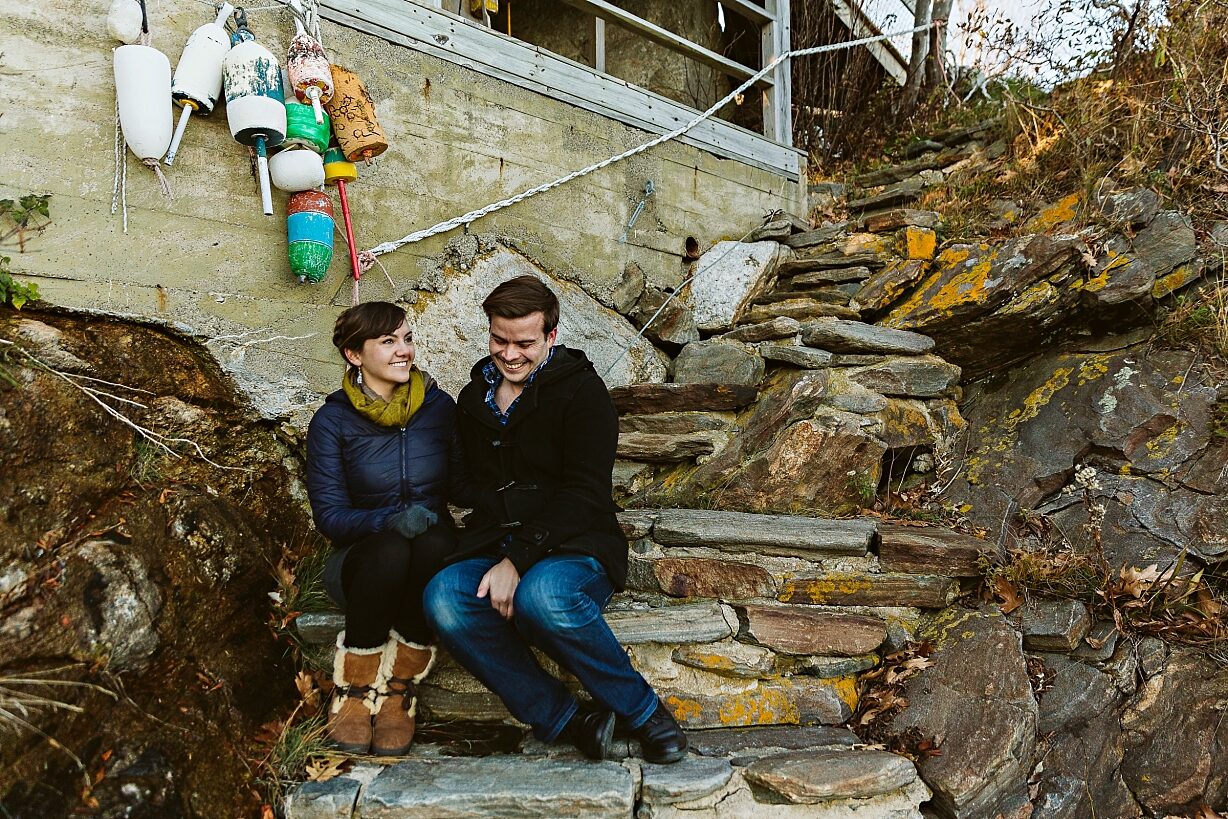 Couple sitting on stairs, laughing