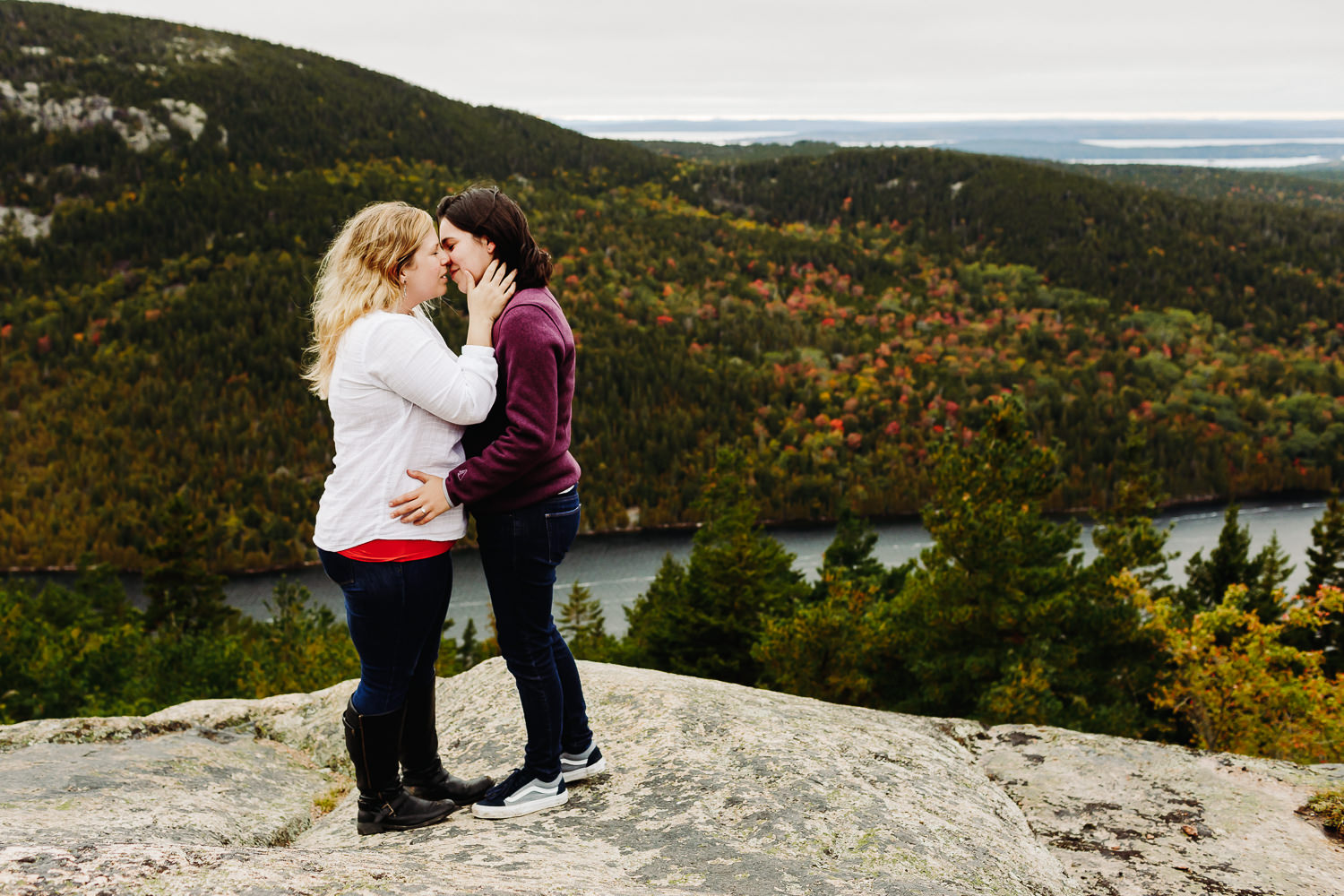 Two women kissing after Acadia National Park Proposal at Beech Mountain
