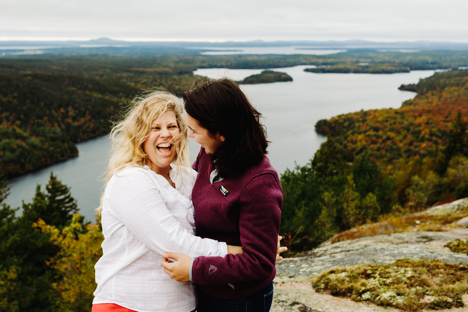 Two happy women after Acadia National Park proposal at Beech Mountain