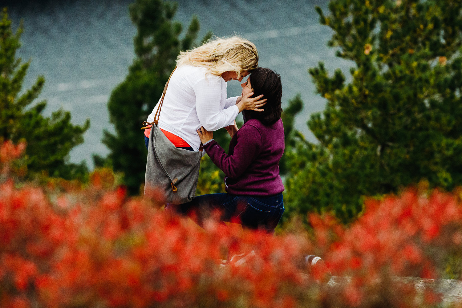 two women getting engaged on Beech Mountain in Acadia National Park