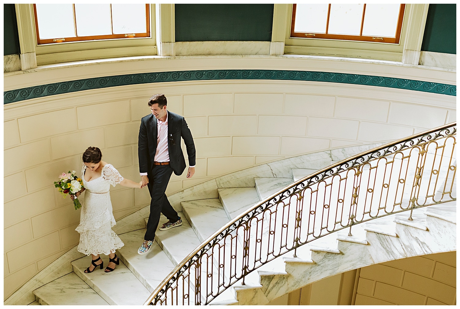 bride and groom on stairs at city hall during Portland Maine elopement