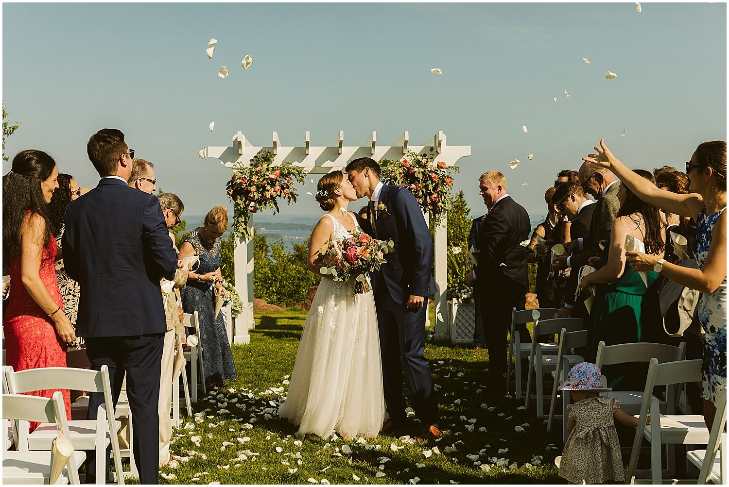 Newlyweds kissing at Maine wedding