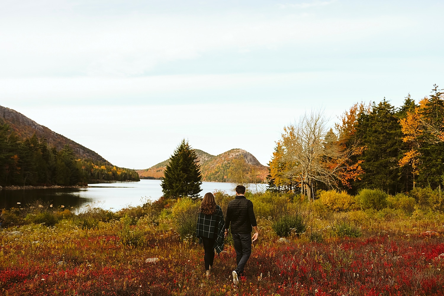 couple walking at Jordan Pond in Acadia National Park