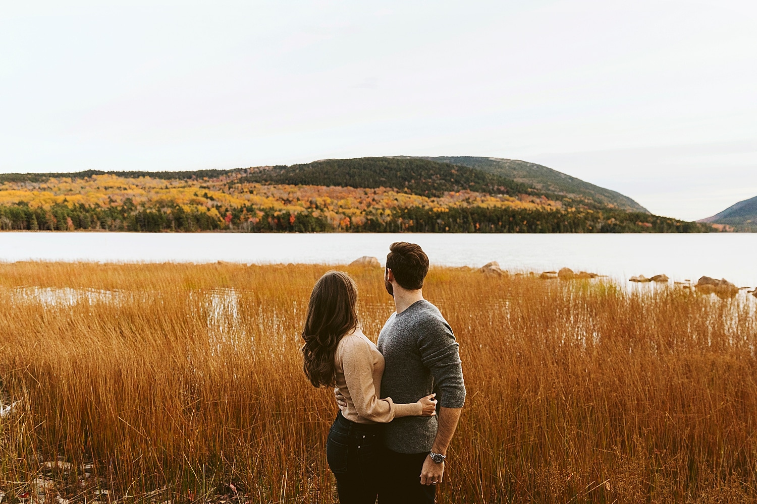 couple with fall foliage at Eagle Lake