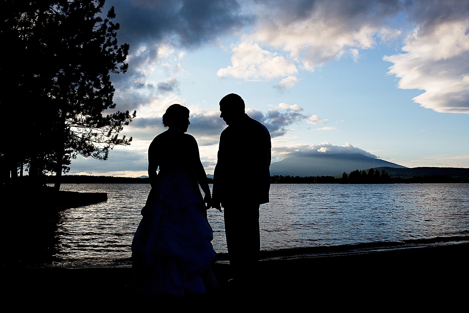 Silhouette of bride and groom with Mount Katahdin at New England Outdoor Center wedding