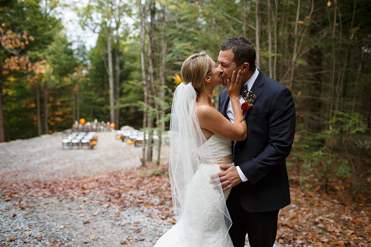 Bride and groom kiss at October Wedding at Granite Ridge Estate & Barn