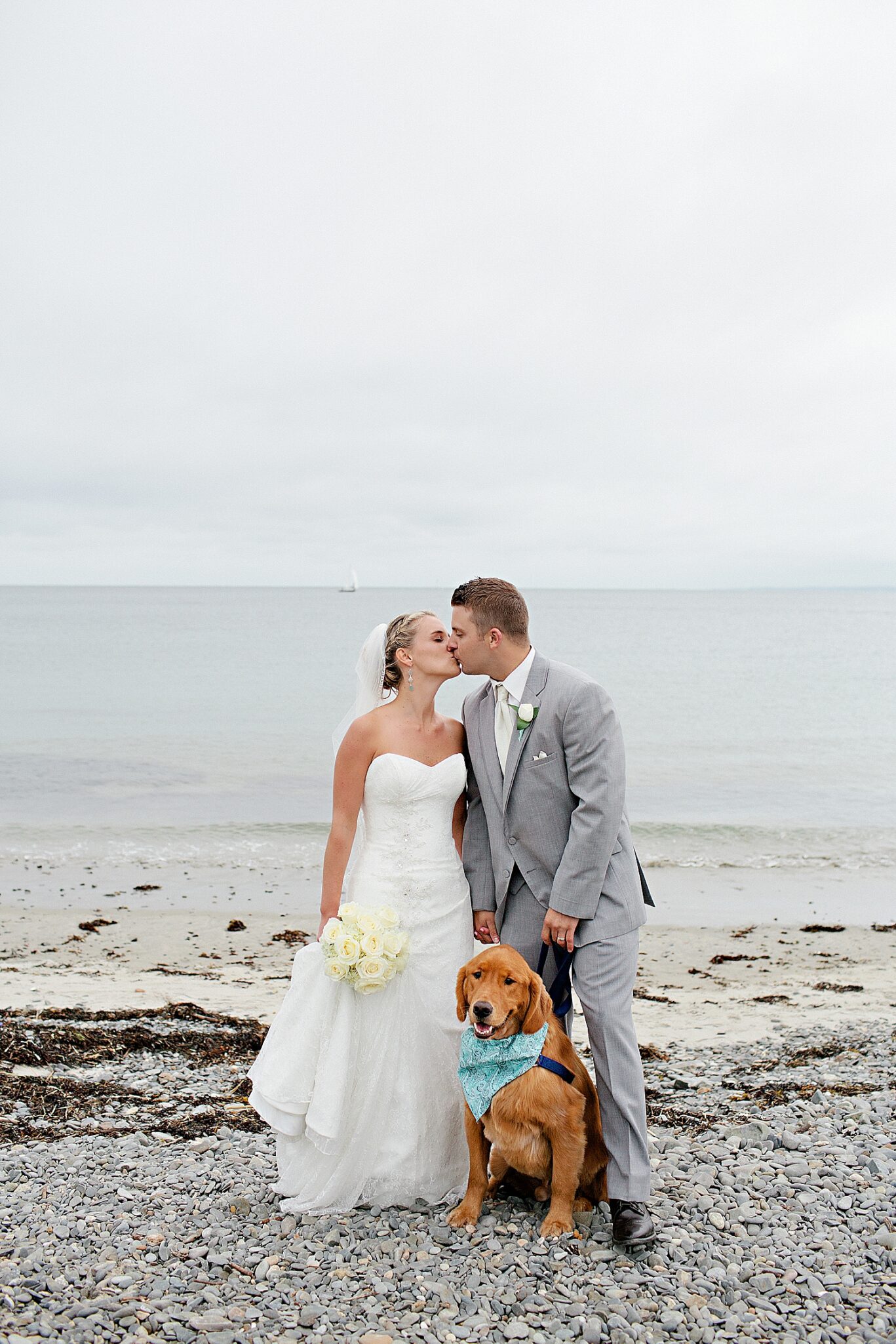 Bride and groom with their Golden Retriever at wedding at the Colony Hotel in Kennebunkport, Maine