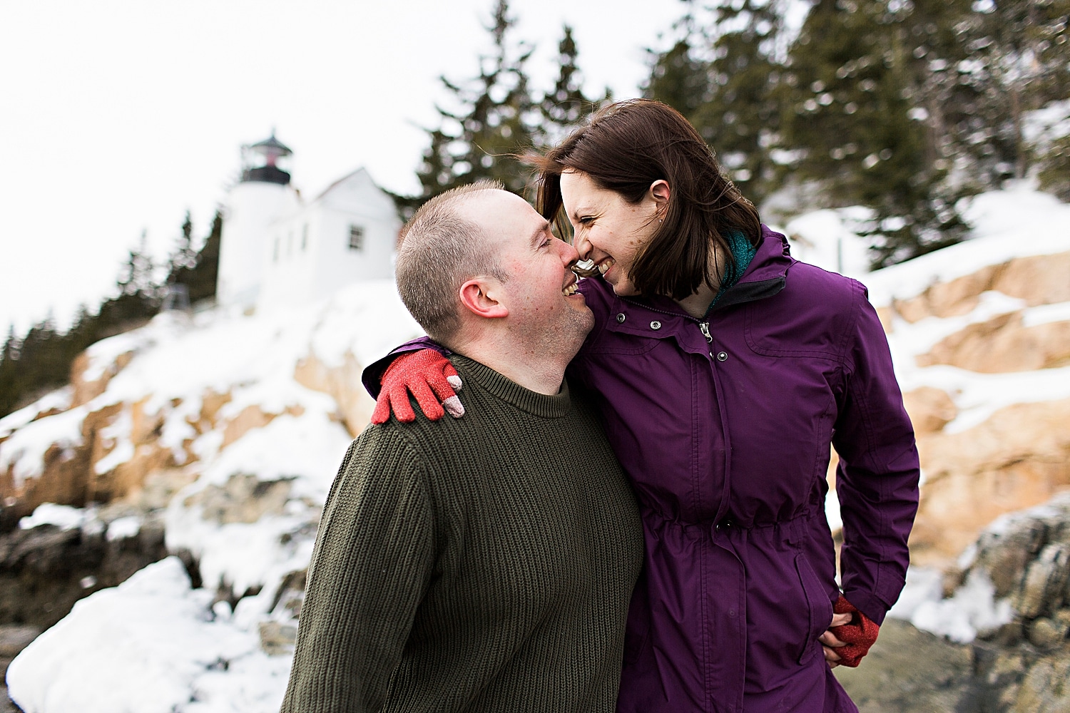 Engaged couple during winter engagement photos in Acadia National Park