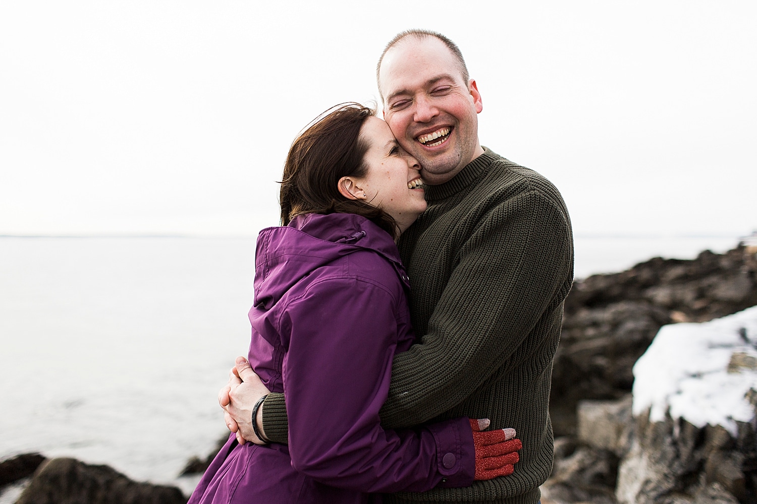 couple during winter engagement photos in Acadia National Park