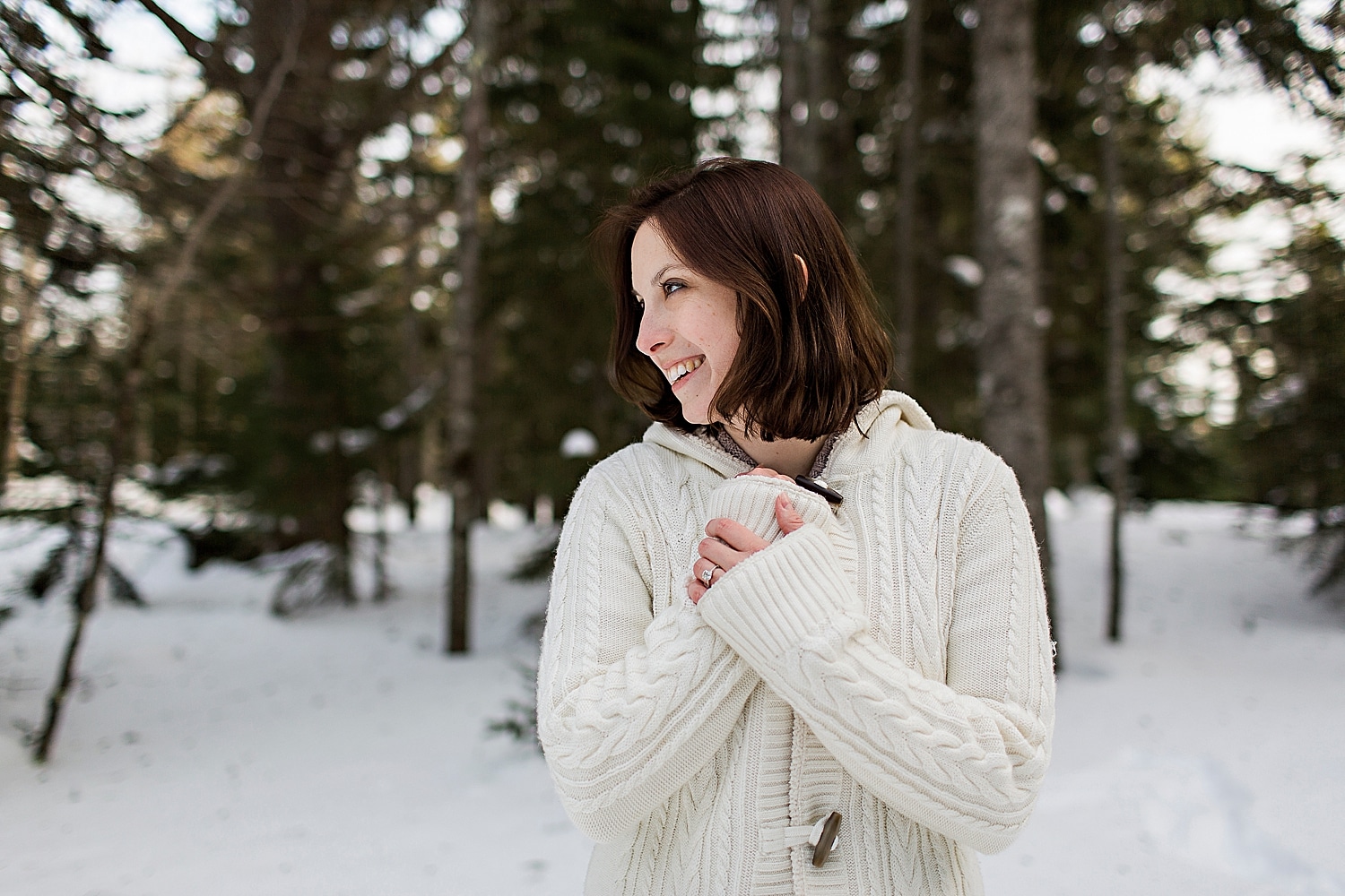 Bride-to-be during winter engagement photos in Acadia National Park