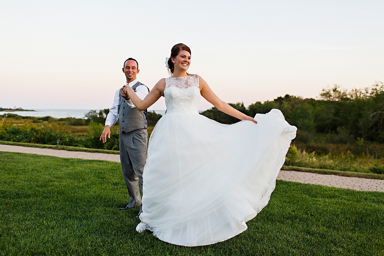 Bride and groom dancing at sunset at Cape Elizabeth maine wedding