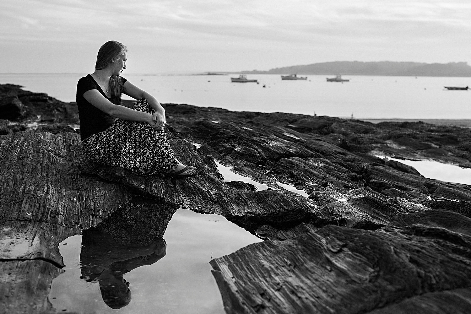 reflection of senior at Maine Senior Portraits at Kettle Cove in Cape Elizabeth