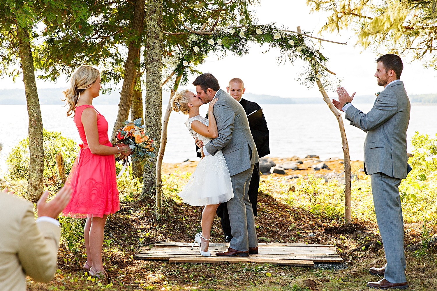 first kiss during intimate Maine wedding in Ellsworth