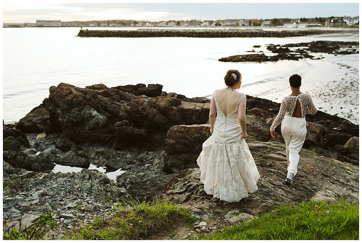 two brides on cliffs during Kennebunkport Maine wedding at The Colony Hotel