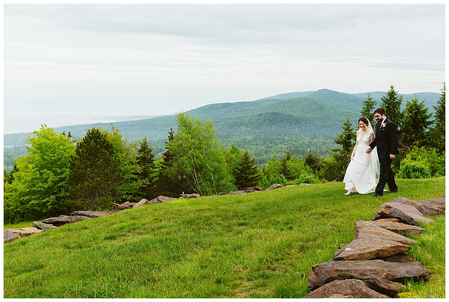 bride and groom with Camden Hills in the background at Northport Maine wedding