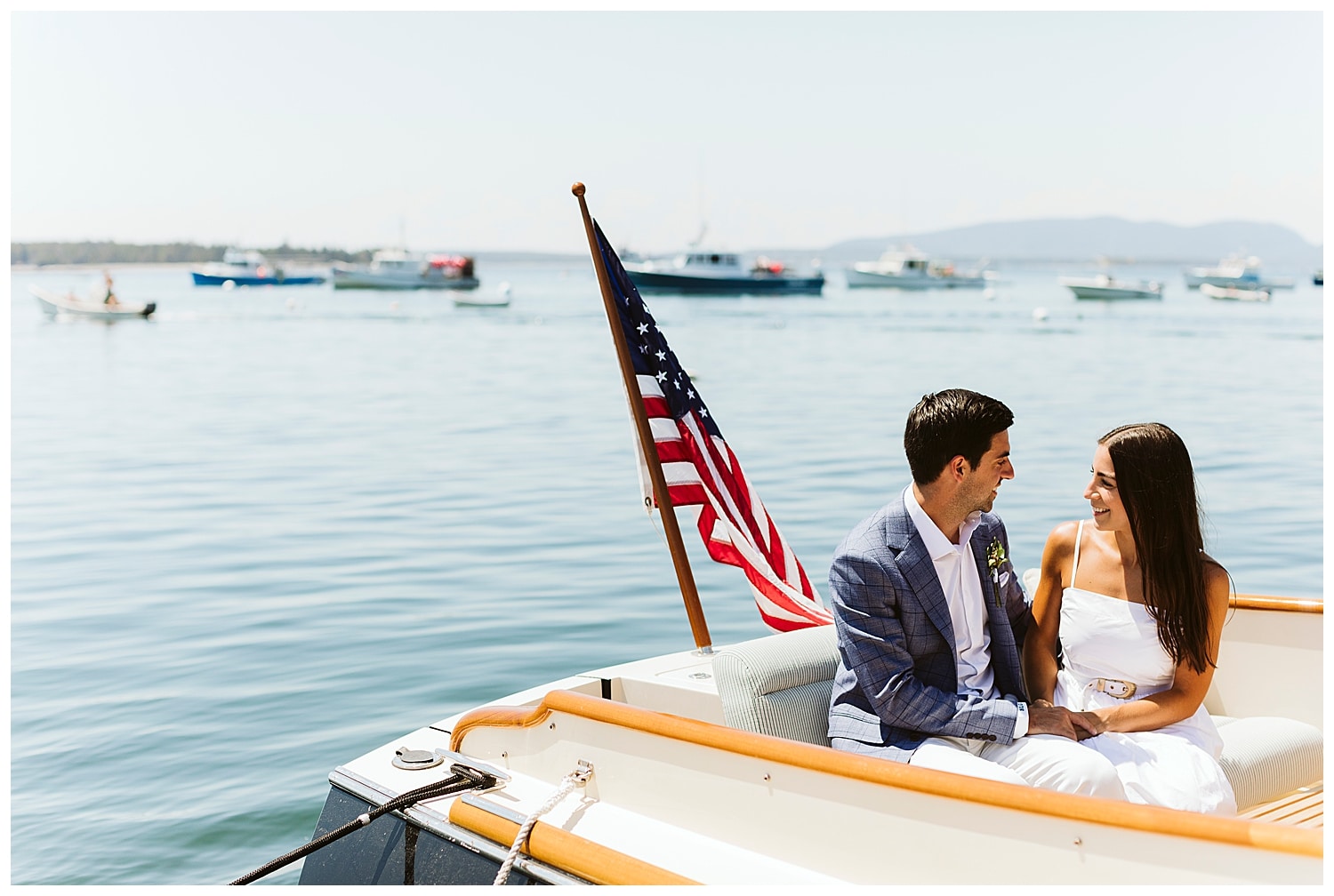 bride and groom in boat during little cranberry island maine wedding