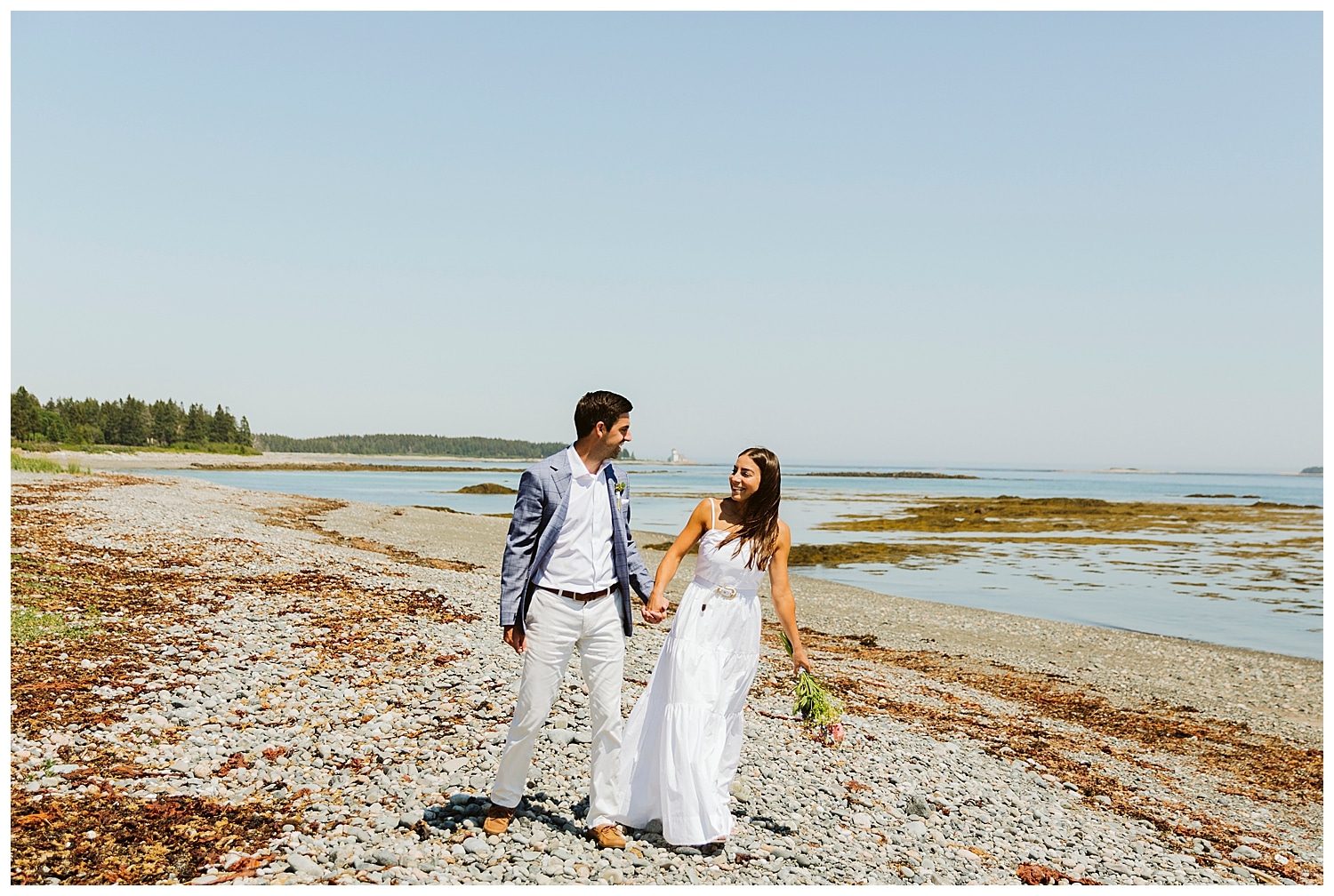 bride and groom walking on beach at little cranberry island maine wedding