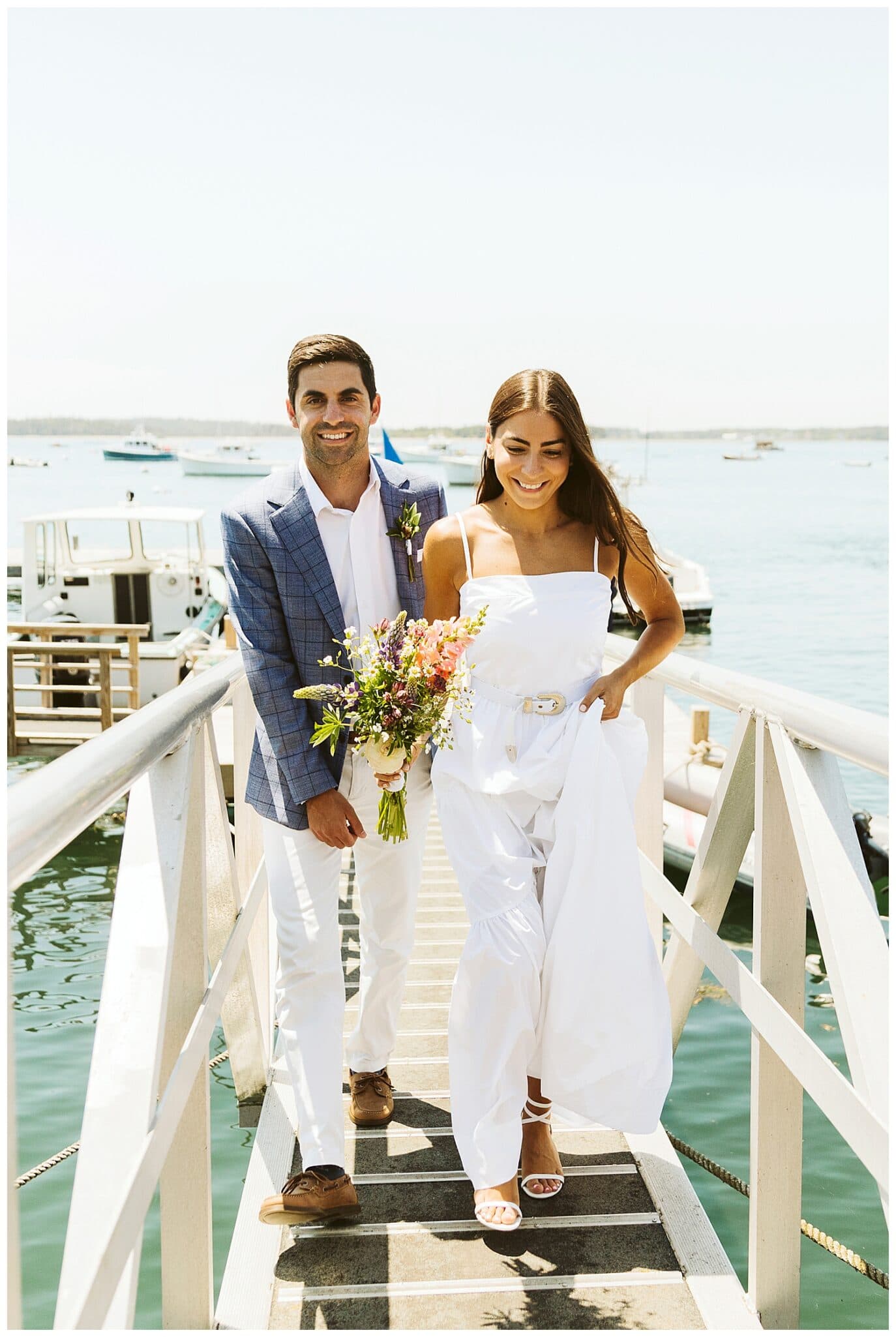 bride and groom walking up dock on Isleford