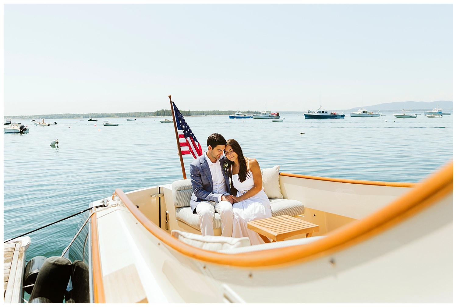 bride and groom sitting on boat