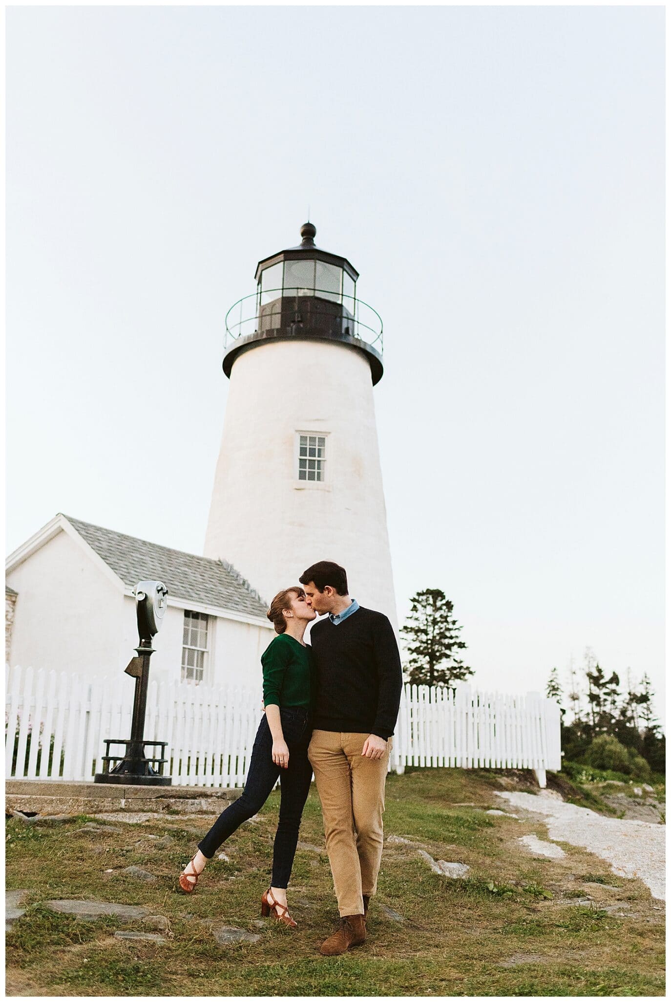 couple in front of Pemaquid Point lighthouse