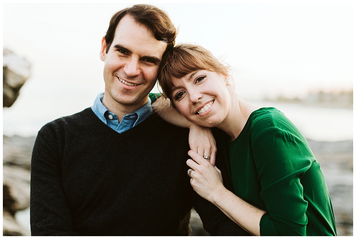 couple smiling together during Maine engagement photos