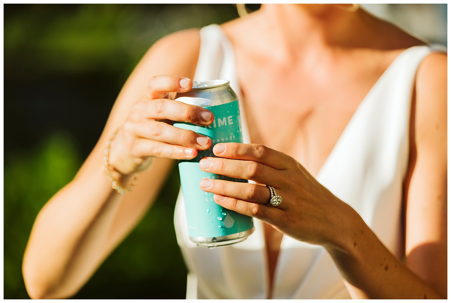 bride holding a beer at microwedding in Watertown, Massachusetts