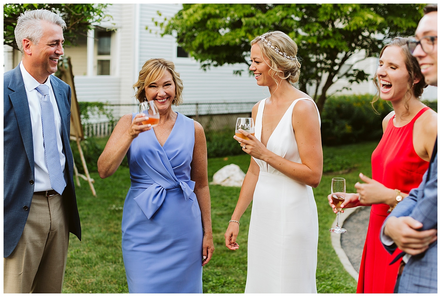 family laughing together at Watertown, MA wedding