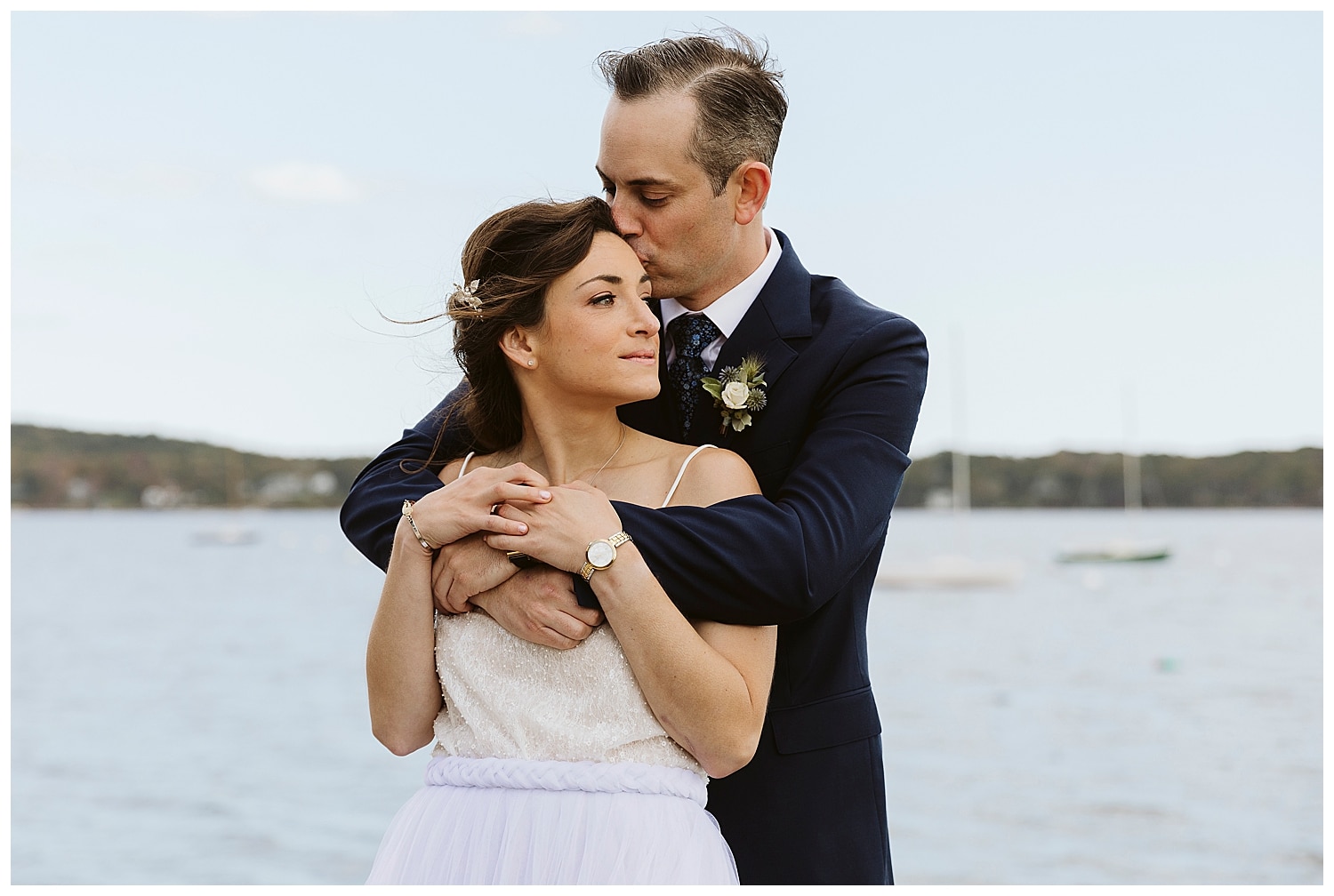 broom kissing bride's head at Boothbay Harbor, Maine wedding at Linekin Bay Resort