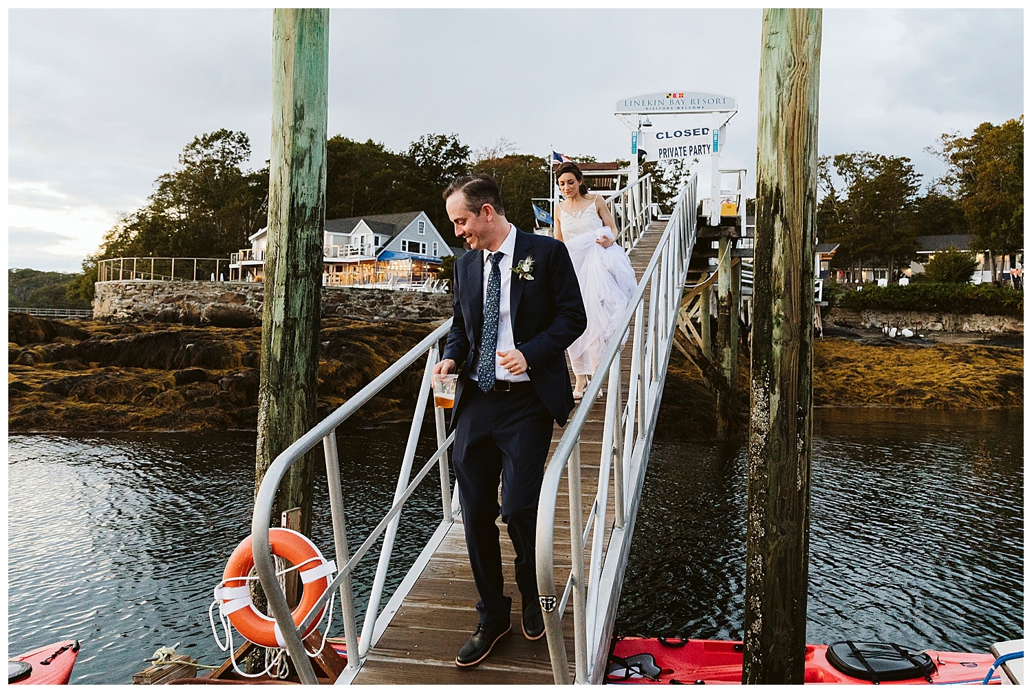 bride and groom on dock at Boothbay Harbor, Maine wedding at Linekin Bay Resort