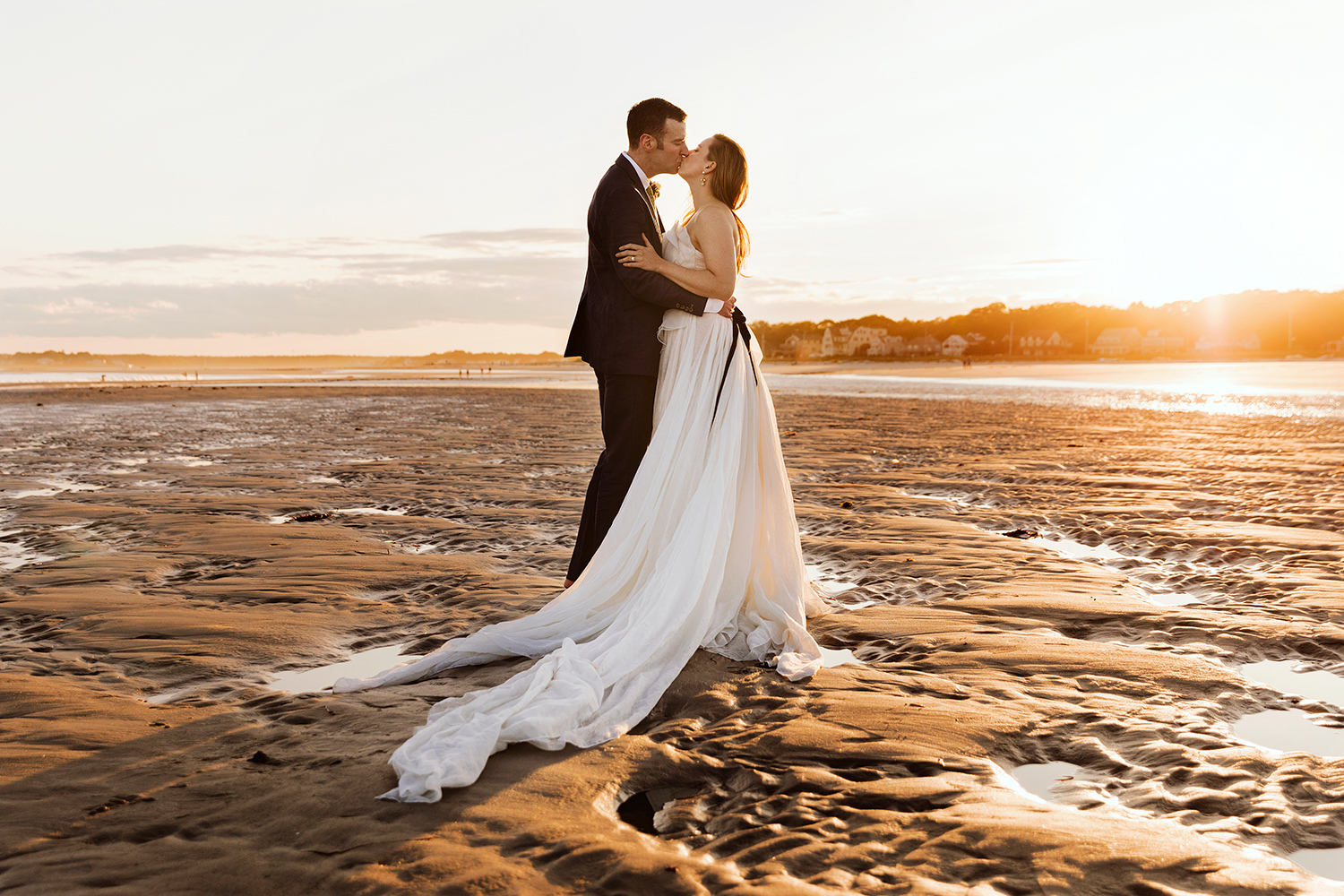 couple kissing on Goose Rocks Beach after micro wedding in Kennebunkport Maine