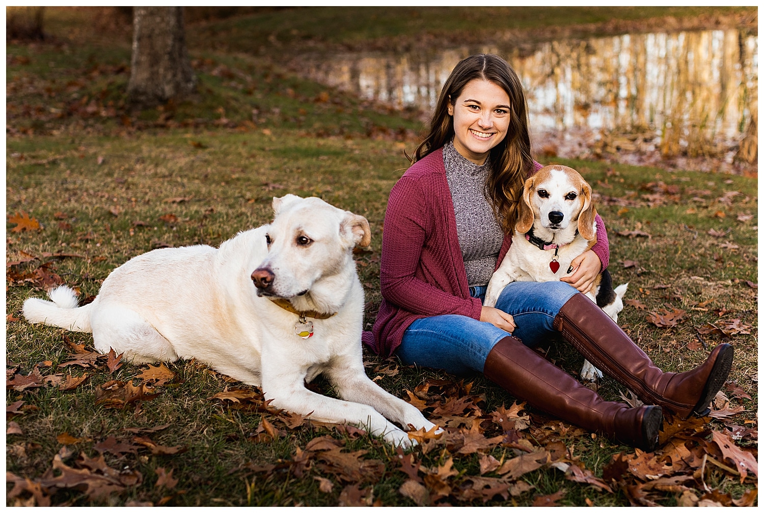 woman posing with two dogs