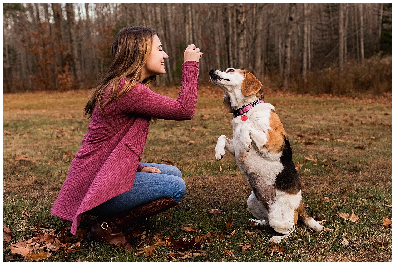 woman giving treats to a beagle