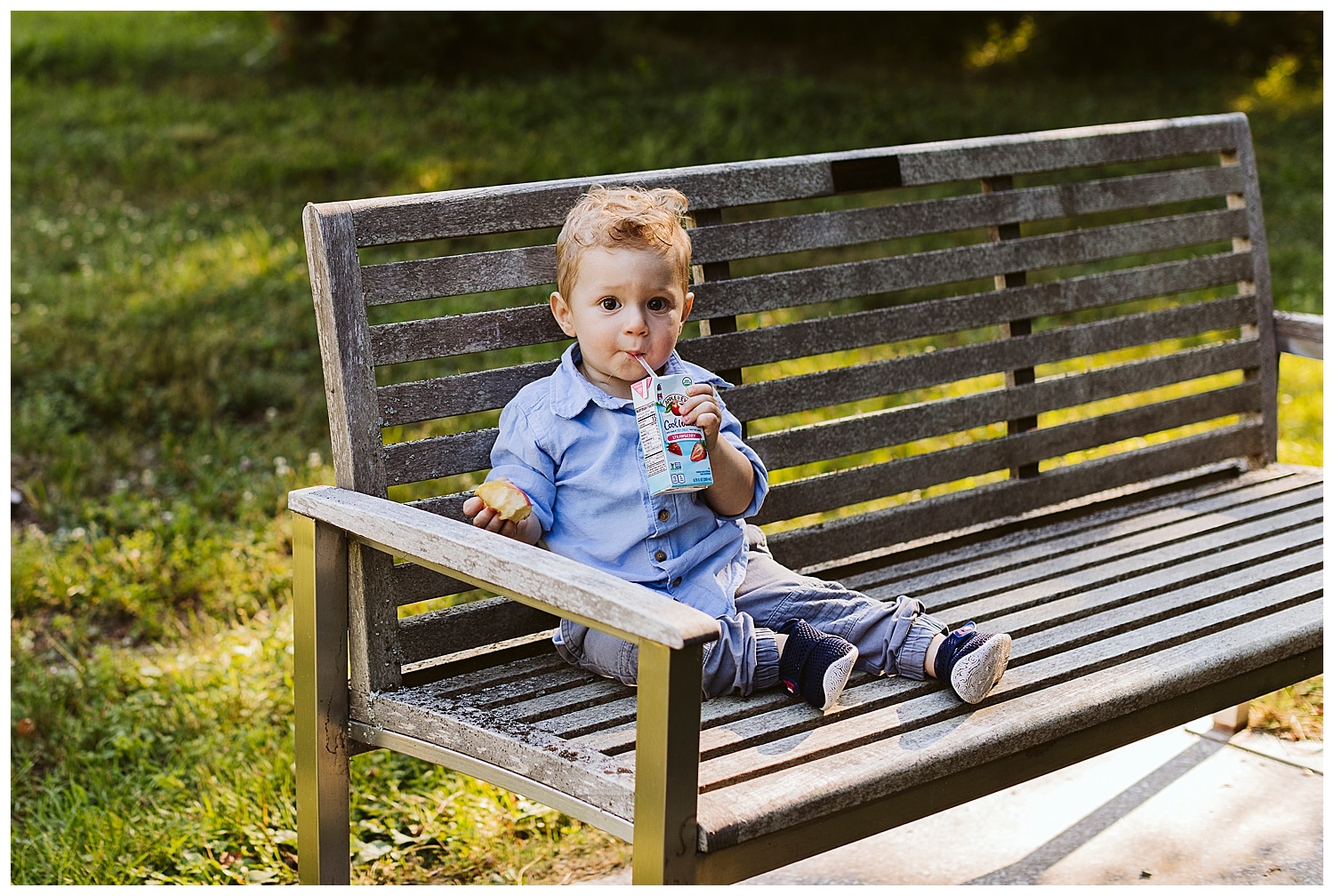 little boy drinking a juice box
