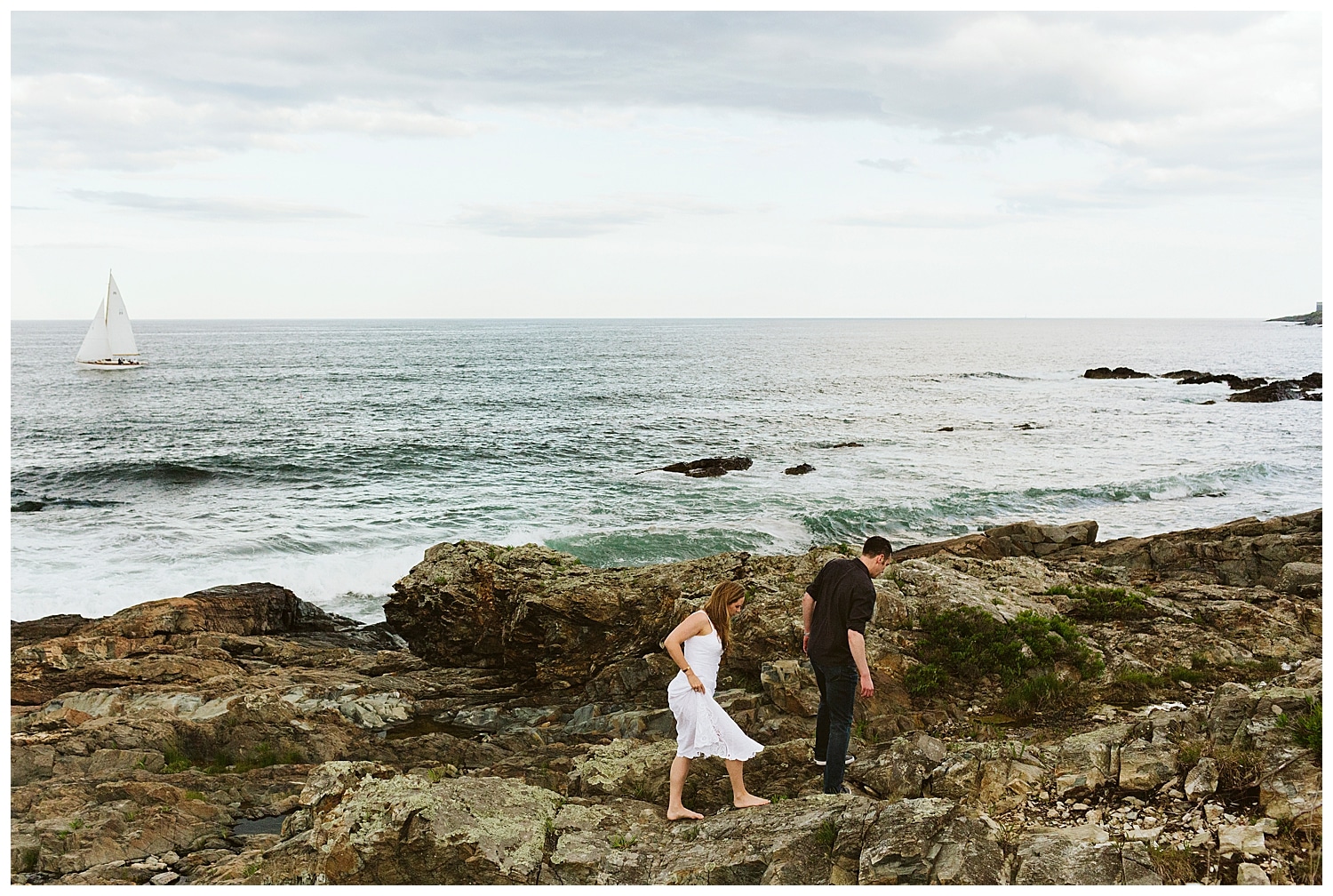 couple walking on cliffs during Ogunquit, Maine engagement photos
