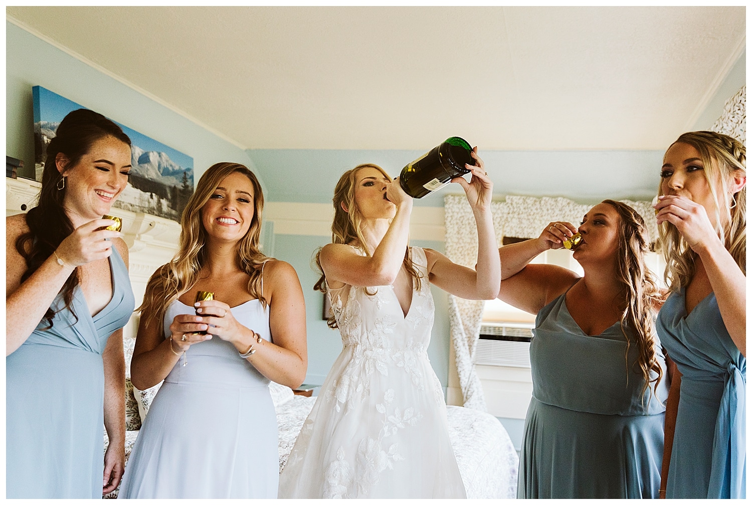 bride and bridesmaids doing shots before wedding ceremony