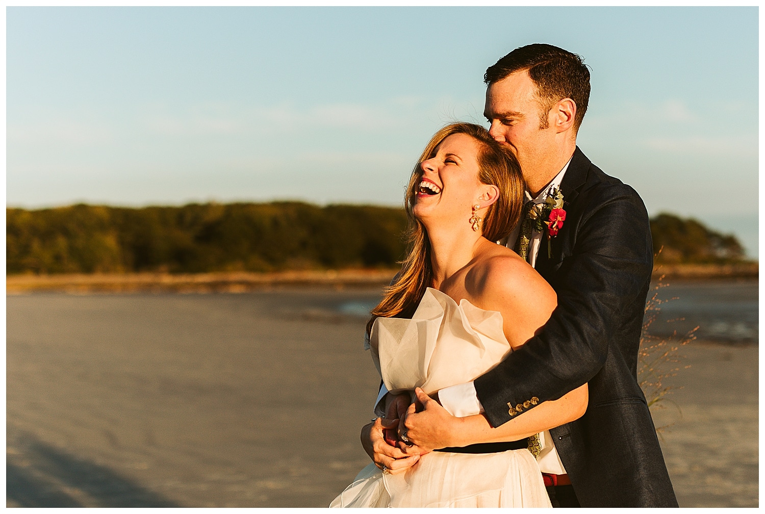 couple laughing at sunset after Goose Rocks Beach wedding ceremony