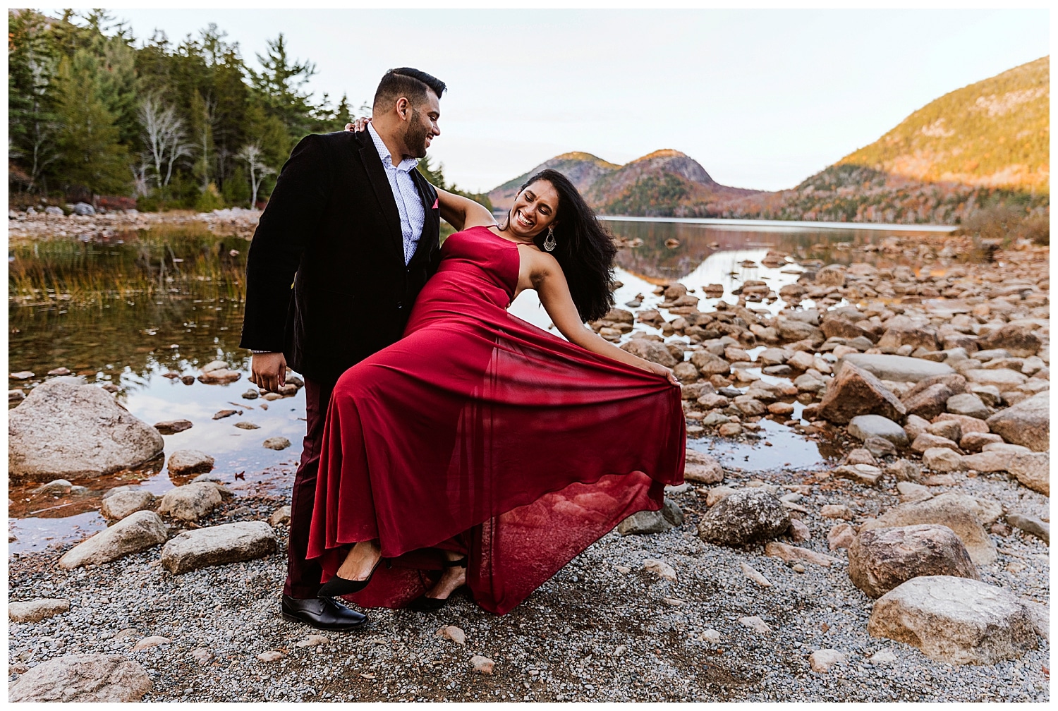 man dipping woman during Jordan Pond and Otter Point Acadia Engagement Photos