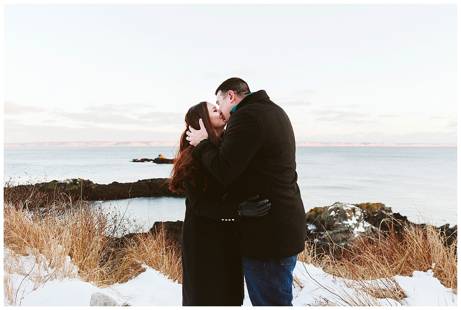 couple kissing during engagement photos at Quoddy Head State Park