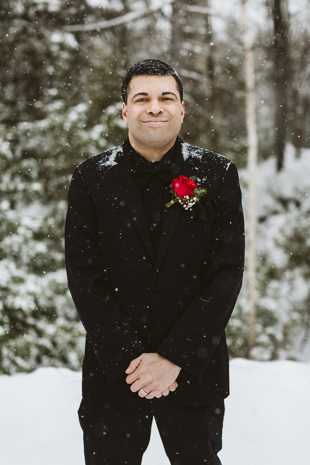 portrait of groom at winter wedding in Millinocket Maine