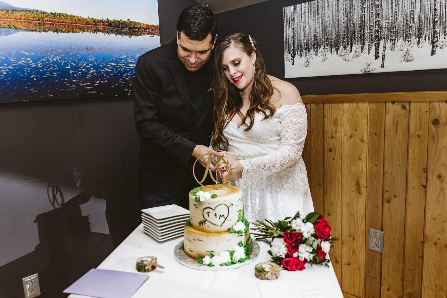 bride and groom cutting their wedding cake at NEOC
