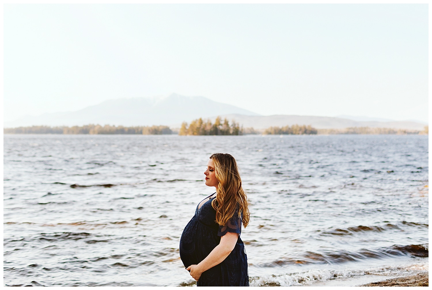 Pregnant woman standing in front of Mount Katahdin