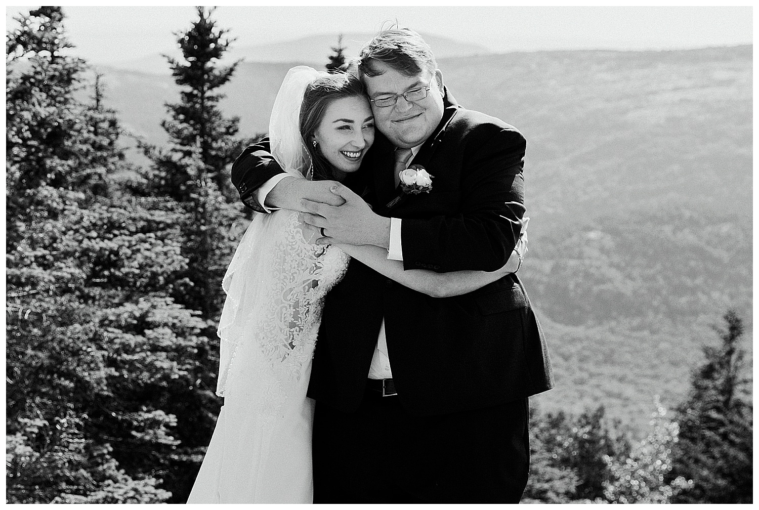 newlyweds embrace during intimate wedding in Acadia National Park