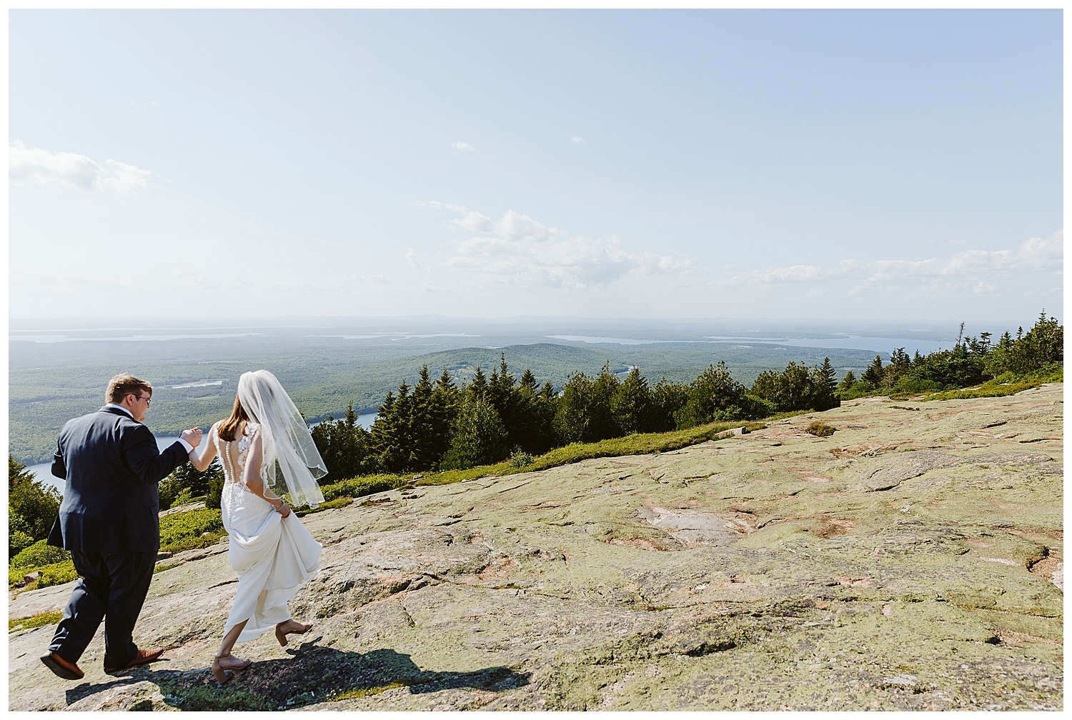 bride and groom walk together in Acadia National Park after wedding ceremony