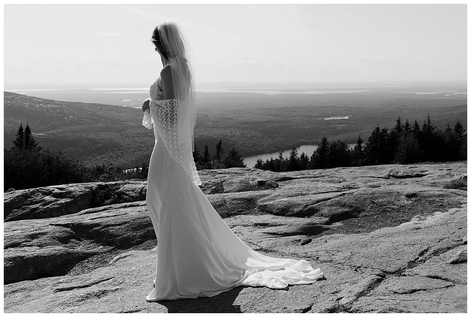 black and white photo of bride on Cadillac Mountain